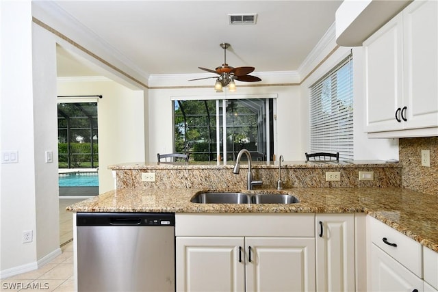 kitchen featuring white cabinetry, dishwasher, light stone counters, and sink