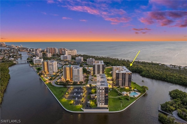 aerial view at dusk with a water view