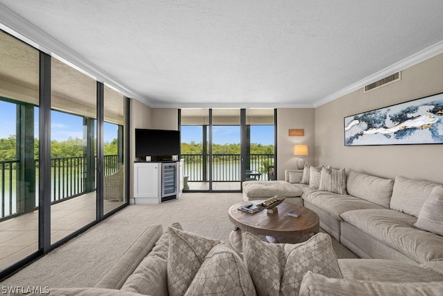 carpeted living room featuring a wealth of natural light, floor to ceiling windows, crown molding, and beverage cooler