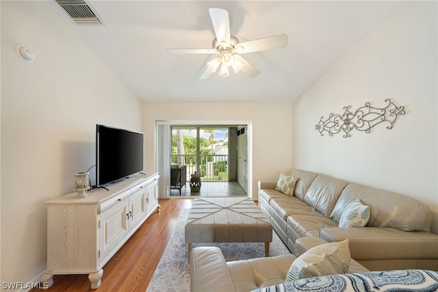 living room featuring ceiling fan and light hardwood / wood-style flooring