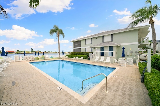 view of swimming pool featuring a patio