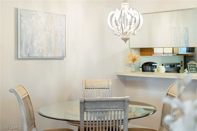 dining area with a notable chandelier