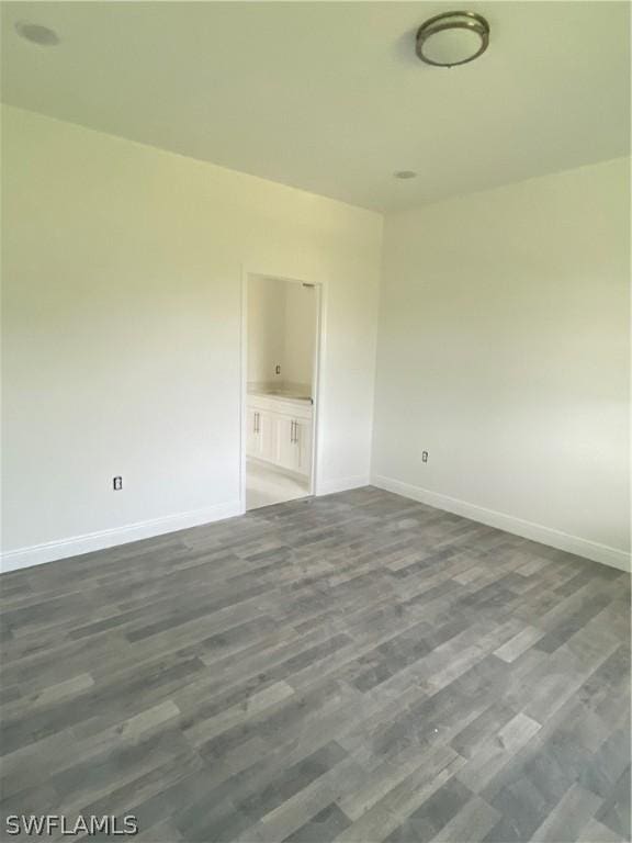 empty room featuring dark hardwood / wood-style floors