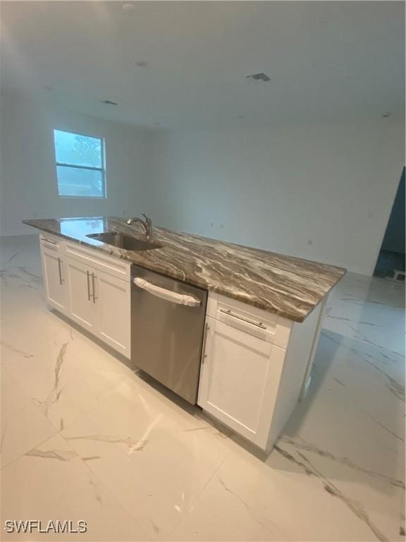 kitchen featuring white cabinetry, sink, and stainless steel dishwasher