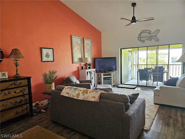 living room with ceiling fan, dark hardwood / wood-style flooring, and high vaulted ceiling