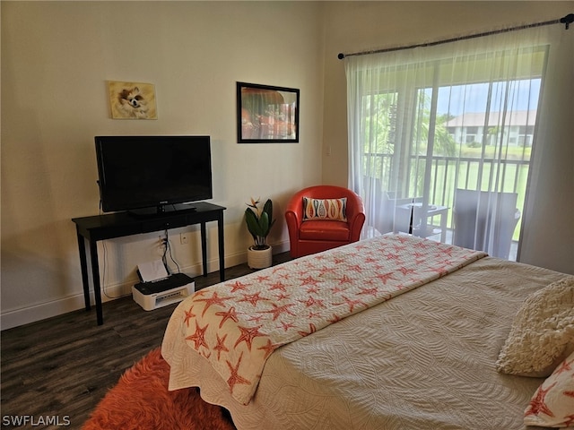 bedroom with dark hardwood / wood-style flooring