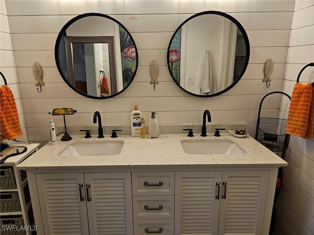 bathroom with wooden walls and vanity