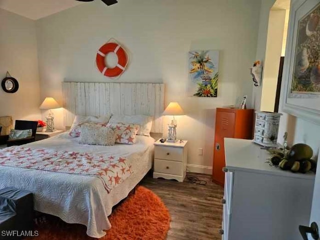 bedroom featuring ceiling fan and dark hardwood / wood-style floors