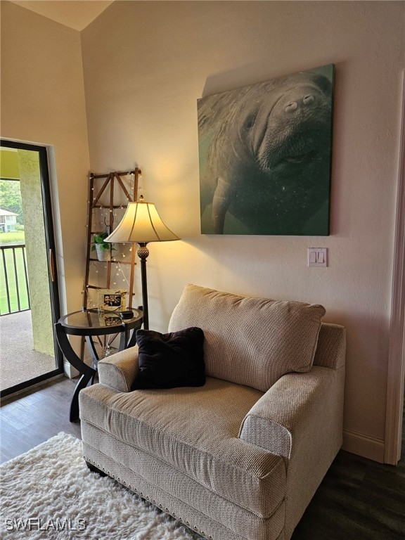 living room with dark hardwood / wood-style flooring