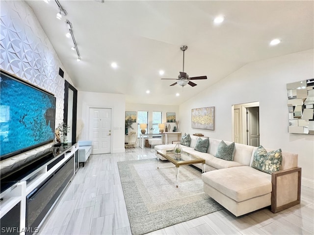 living room featuring track lighting, ceiling fan, and vaulted ceiling