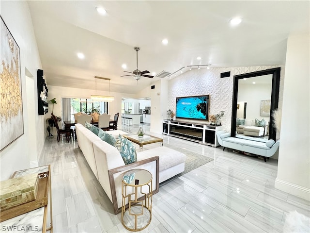 tiled living room featuring lofted ceiling and ceiling fan