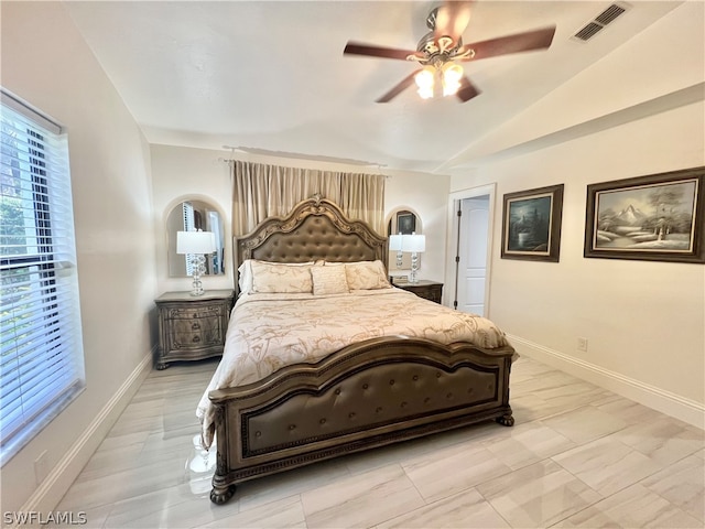 bedroom featuring vaulted ceiling, ceiling fan, and light tile flooring