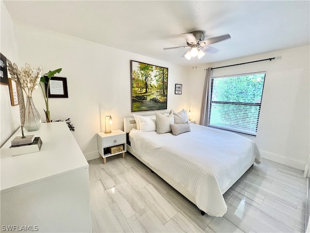 bedroom featuring ceiling fan and light hardwood / wood-style floors