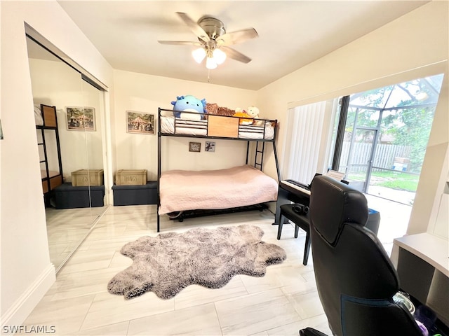 tiled bedroom featuring access to outside, a closet, and ceiling fan