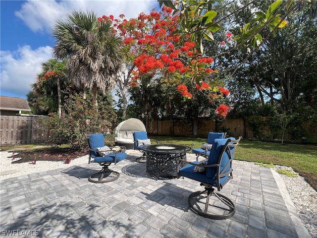 view of patio / terrace with an outdoor fire pit