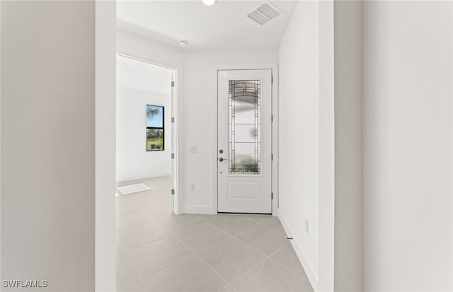 hallway with light tile patterned floors