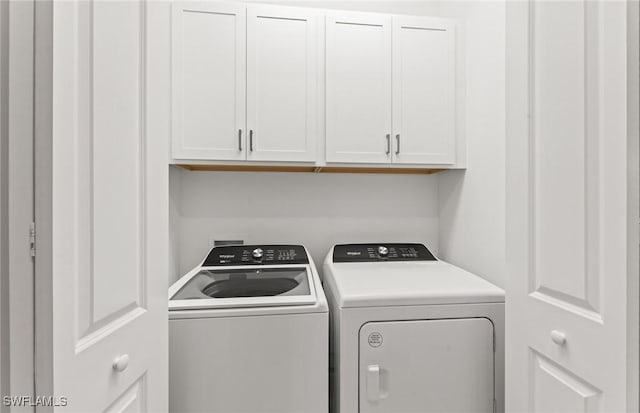 laundry room featuring cabinet space and independent washer and dryer