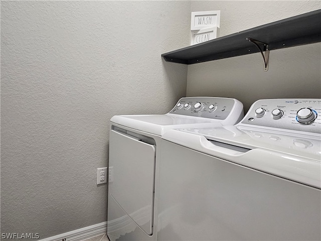 washroom featuring washing machine and dryer