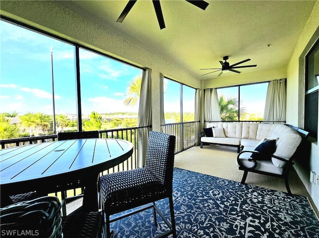 sunroom / solarium with ceiling fan