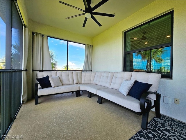 sunroom featuring ceiling fan