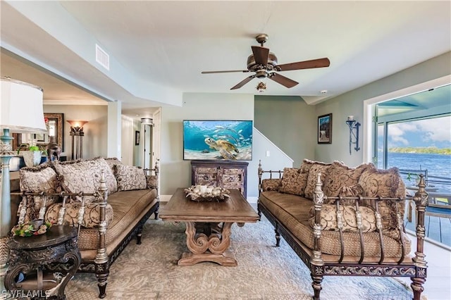 living room with ceiling fan and hardwood / wood-style floors