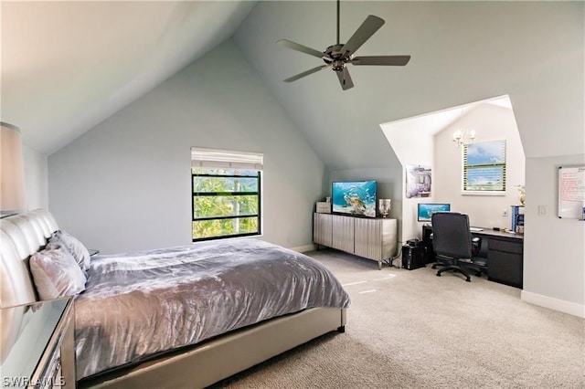 carpeted bedroom featuring ceiling fan with notable chandelier and lofted ceiling