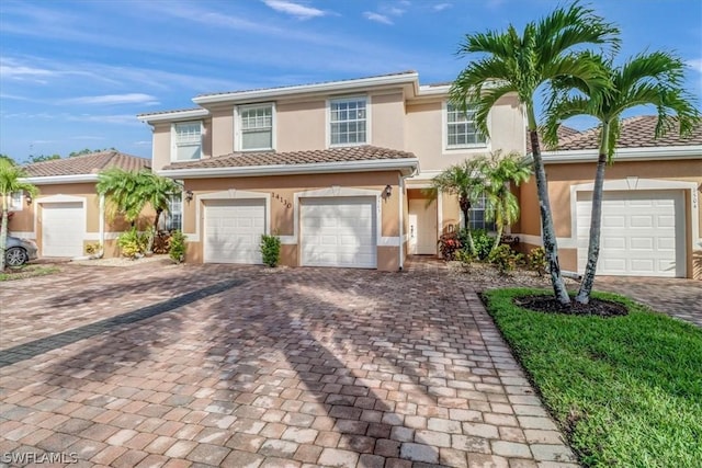 mediterranean / spanish-style home featuring a garage