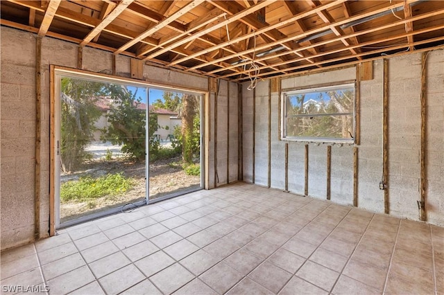 misc room with light tile patterned floors