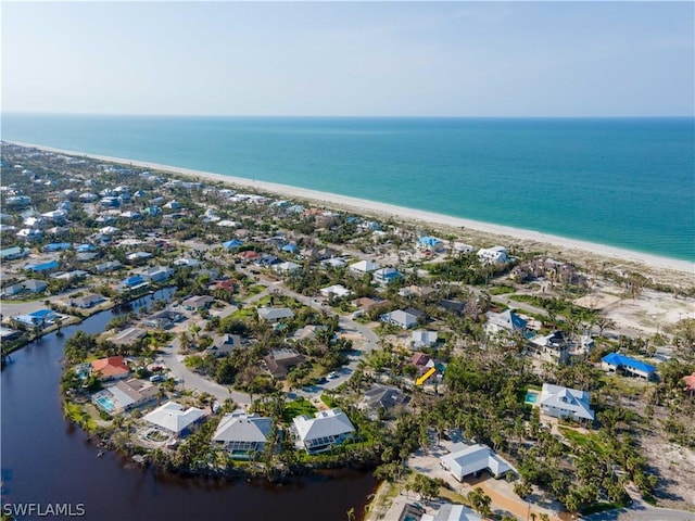 bird's eye view with a view of the beach and a water view