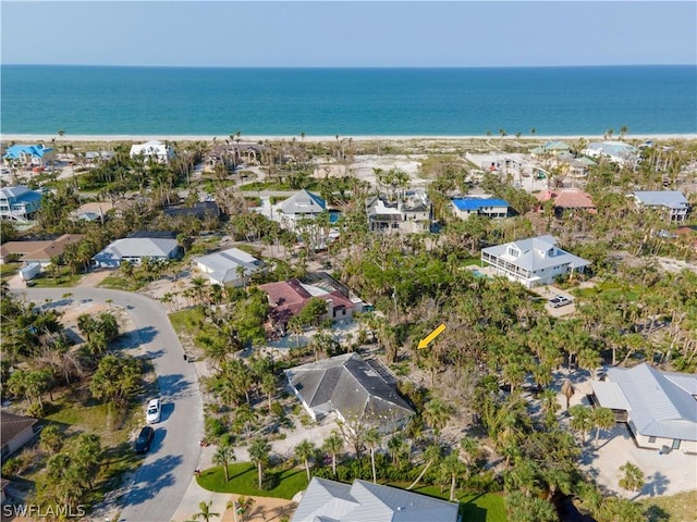 drone / aerial view with a view of the beach and a water view