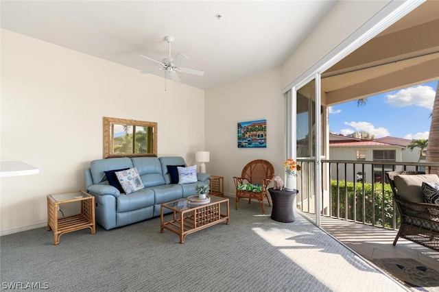 living room with ceiling fan and carpet floors