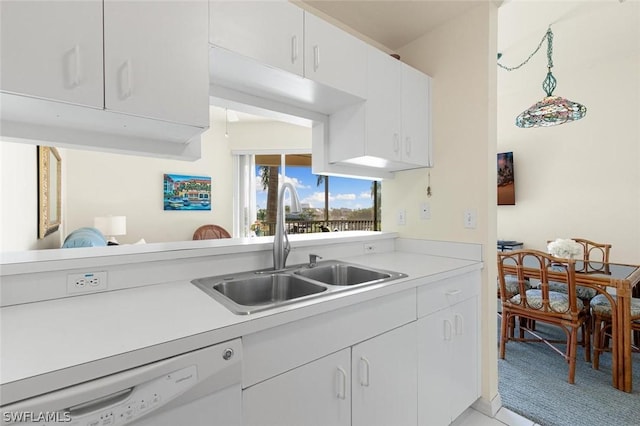 kitchen with white cabinetry, sink, kitchen peninsula, and dishwasher