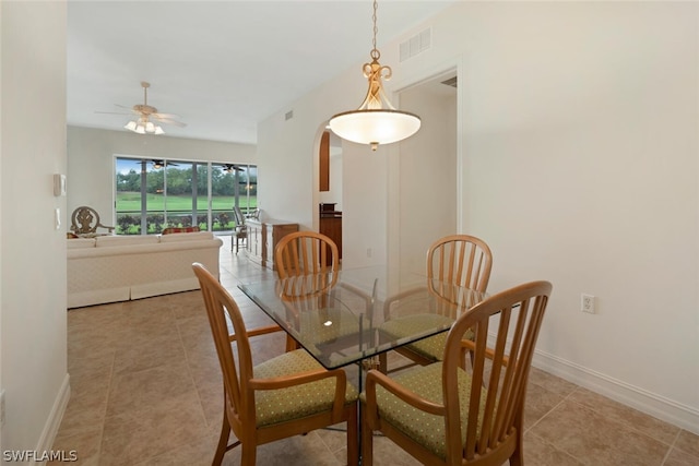 dining area featuring ceiling fan and light tile patterned floors