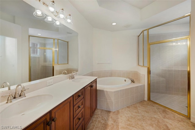 bathroom with tile patterned flooring, vanity, and plus walk in shower