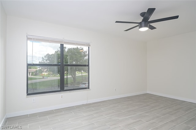 unfurnished room featuring ceiling fan