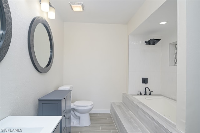 bathroom with toilet, a shower, and vanity