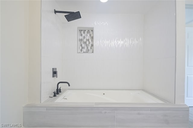 bathroom with tiled tub