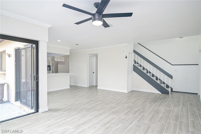 unfurnished living room with ceiling fan, ornamental molding, and light hardwood / wood-style flooring