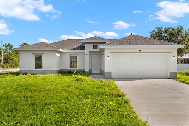 view of front facade with a front lawn and a garage