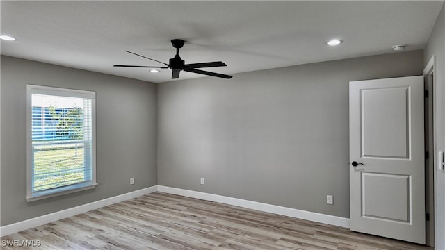 unfurnished room featuring ceiling fan and light hardwood / wood-style floors