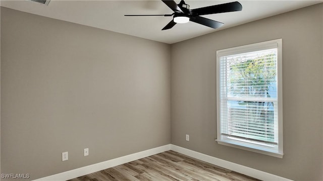 unfurnished room featuring ceiling fan and light hardwood / wood-style flooring