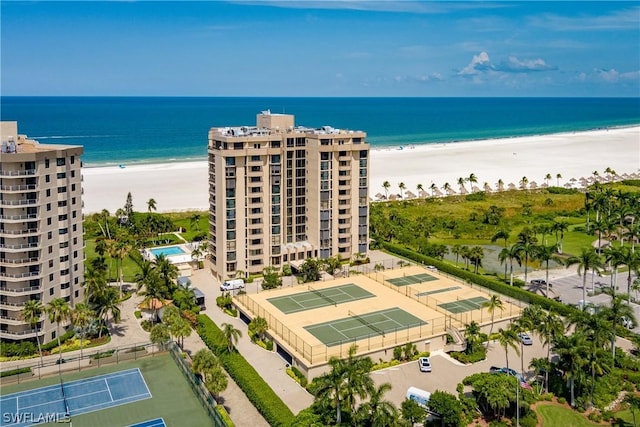 birds eye view of property with a view of the beach and a water view