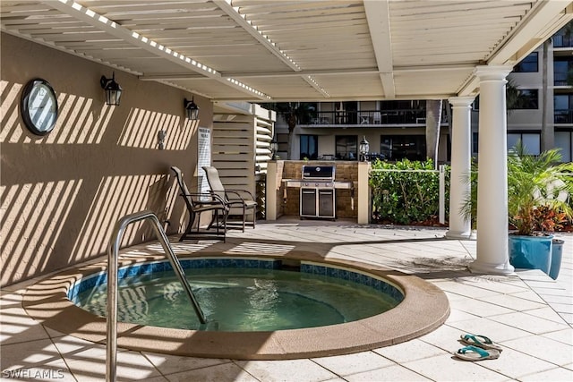 view of pool featuring grilling area and a community hot tub