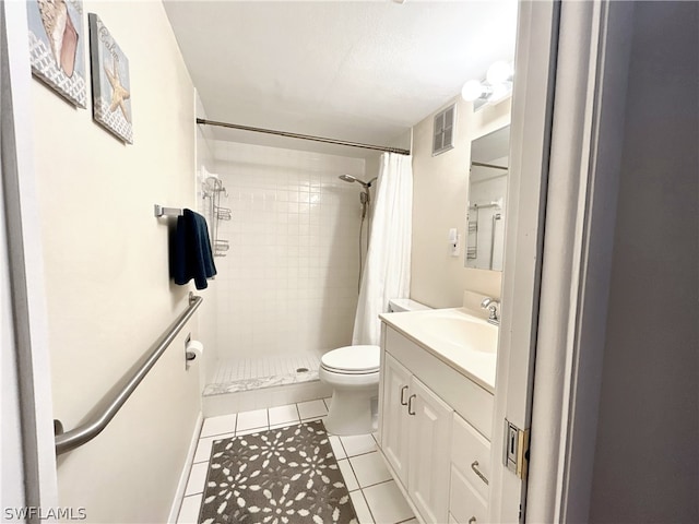 bathroom featuring tile floors, a shower with curtain, toilet, and vanity