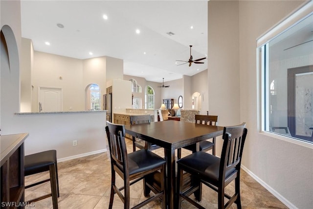 tiled dining room with ceiling fan