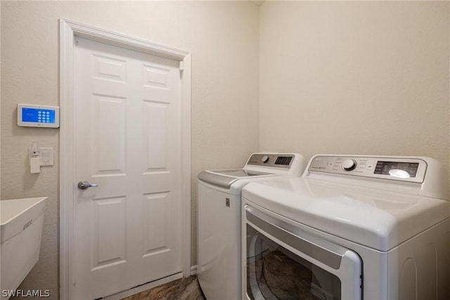 washroom featuring independent washer and dryer