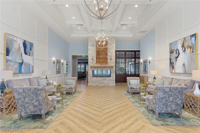 living room with a high ceiling, parquet floors, a notable chandelier, beam ceiling, and coffered ceiling