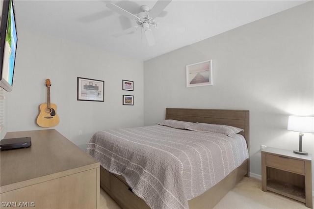 bedroom featuring ceiling fan and light carpet