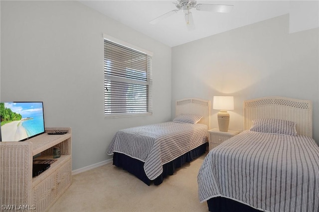 bedroom with ceiling fan and light colored carpet