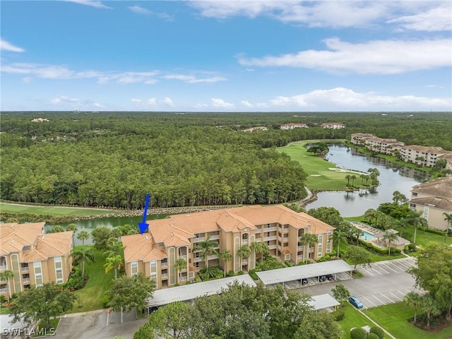 birds eye view of property with a water view